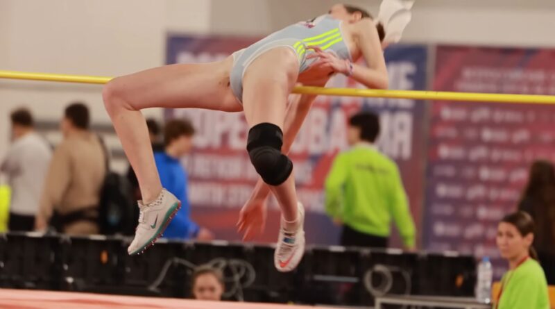 A focused moment before take-off reflects the discipline and preparation behind elite women’s high jump performances.